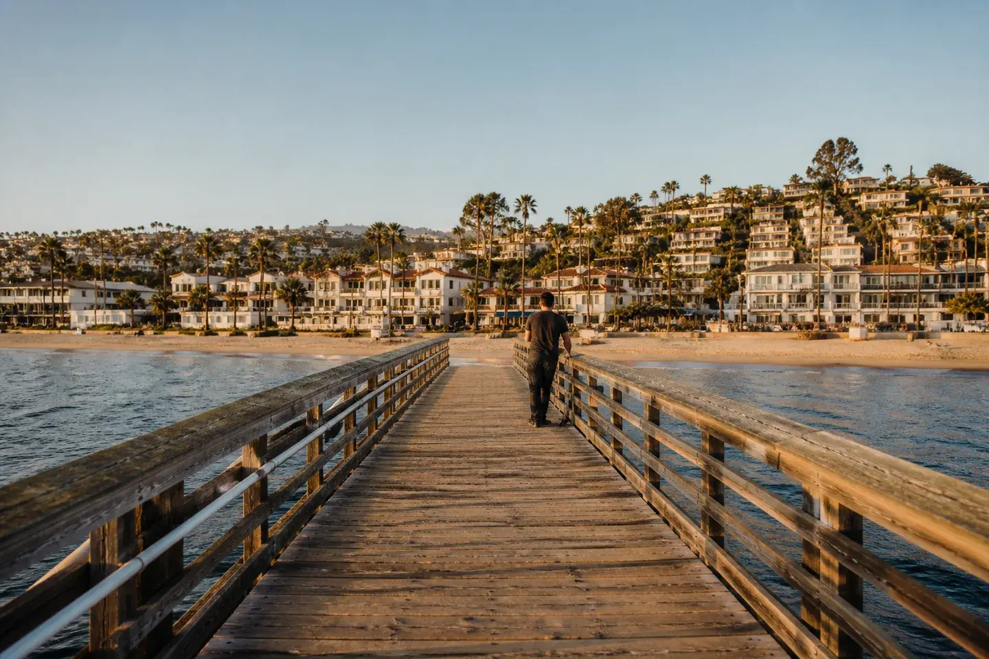 Illustrated memory of a quiet moment on San Clemente pier, looking toward the shore and thinking of family back home